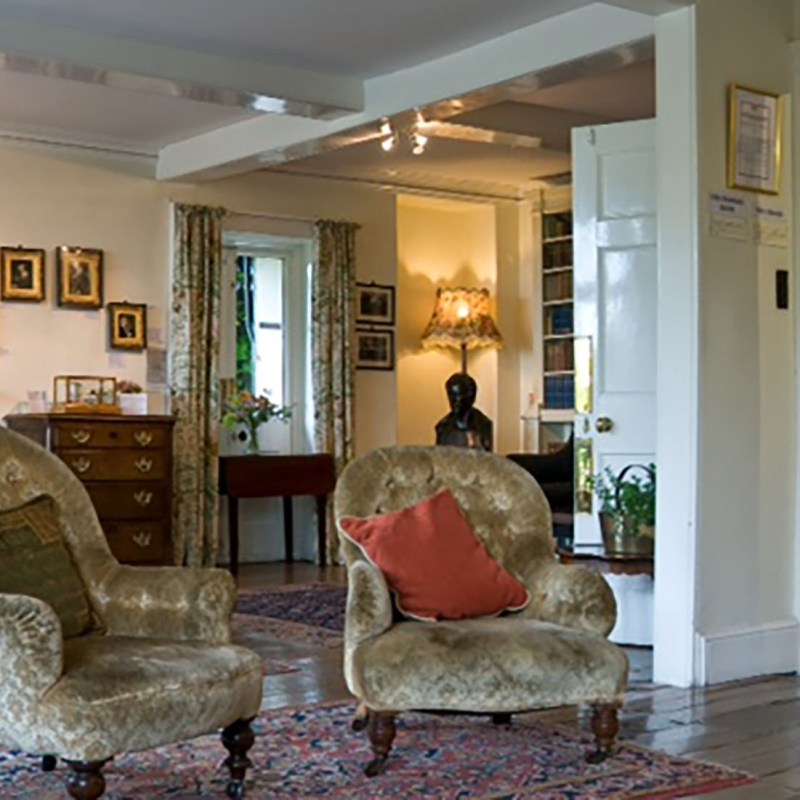 a living room filled with furniture and a fire place