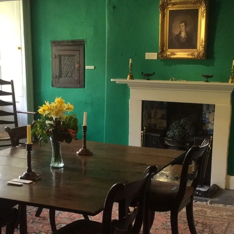 a living room filled with furniture and a fire place