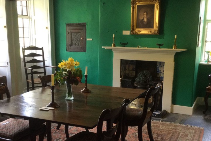 a living room filled with furniture and a fire place